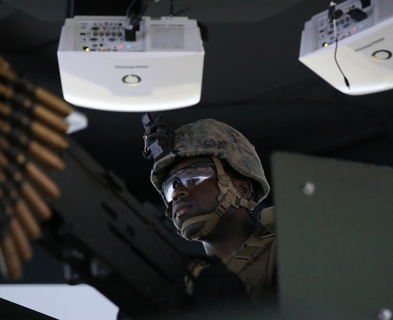 Soldier operating a vehicle mounted gun turrett